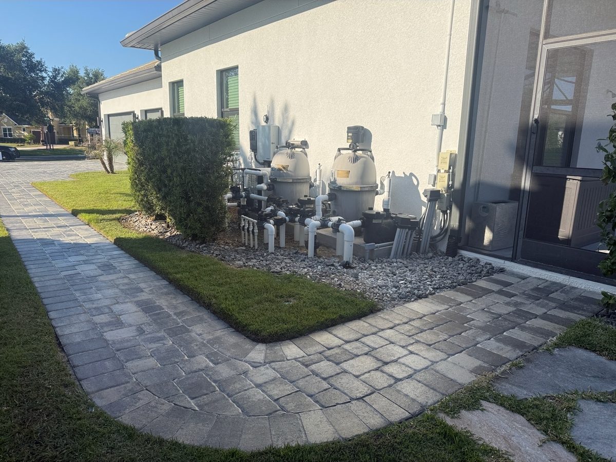 Clean paver walkway beside pool equipment after ProShine Squad cleaning